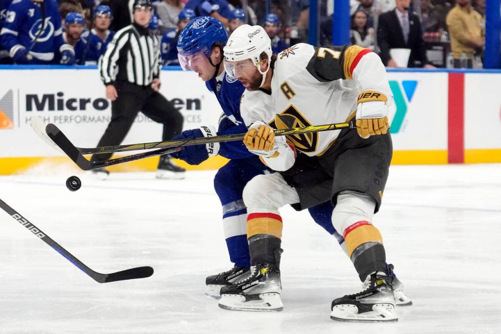 Vegas Golden Knights defenseman Alex Pietrangelo (7) and Tampa Bay Lightning center Conor Geeki ...