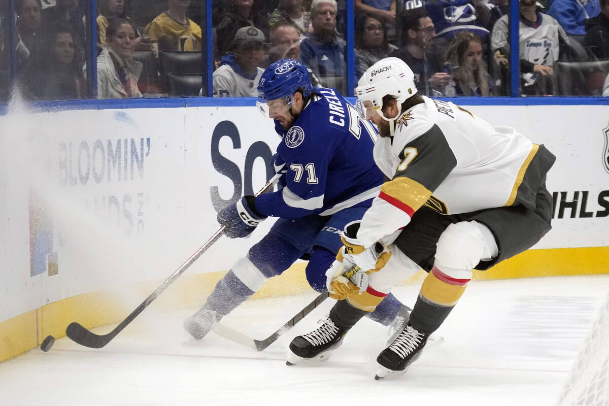 Tampa Bay Lightning center Anthony Cirelli (71) tries to work around Vegas Golden Knights defen ...