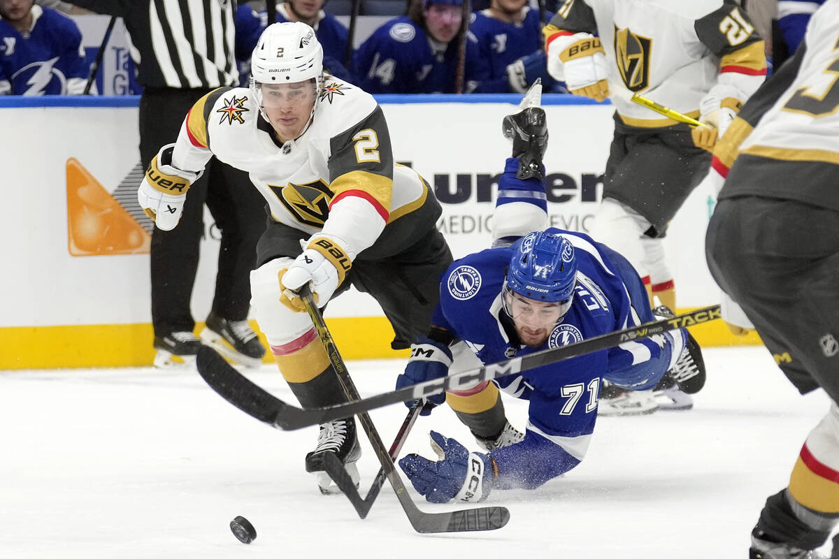 Tampa Bay Lightning center Anthony Cirelli (71) goes down while chasing the puck with Vegas Gol ...