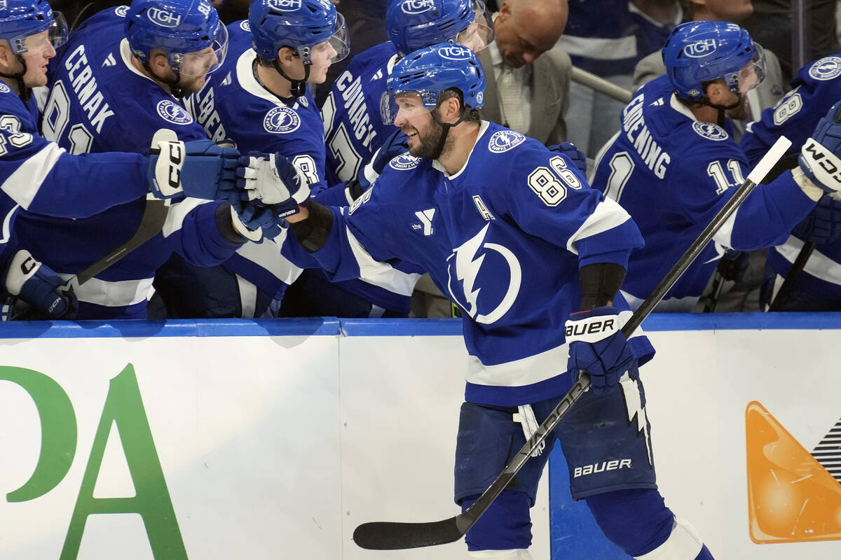 Tampa Bay Lightning right wing Nikita Kucherov (86) celebrates with the bench after scoring aga ...