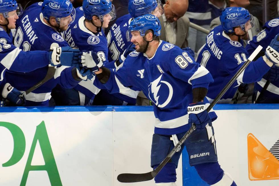 Tampa Bay Lightning right wing Nikita Kucherov (86) celebrates with the bench after scoring aga ...