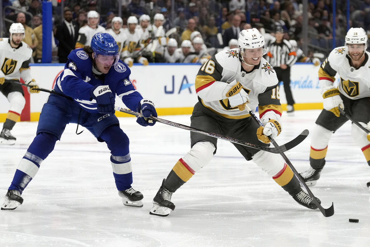 Tampa Bay Lightning center Conor Geekie (14) hooks Vegas Golden Knights left wing Pavel Dorofey ...