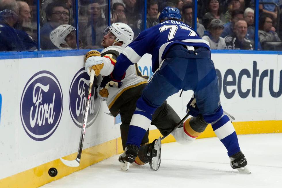 Tampa Bay Lightning defenseman Victor Hedman (77) checks Vegas Golden Knights center Jack Eiche ...