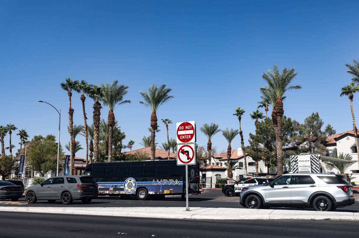 Police investigate the scene of an officer involved shooting near East Tropicana Avenue and Sou ...