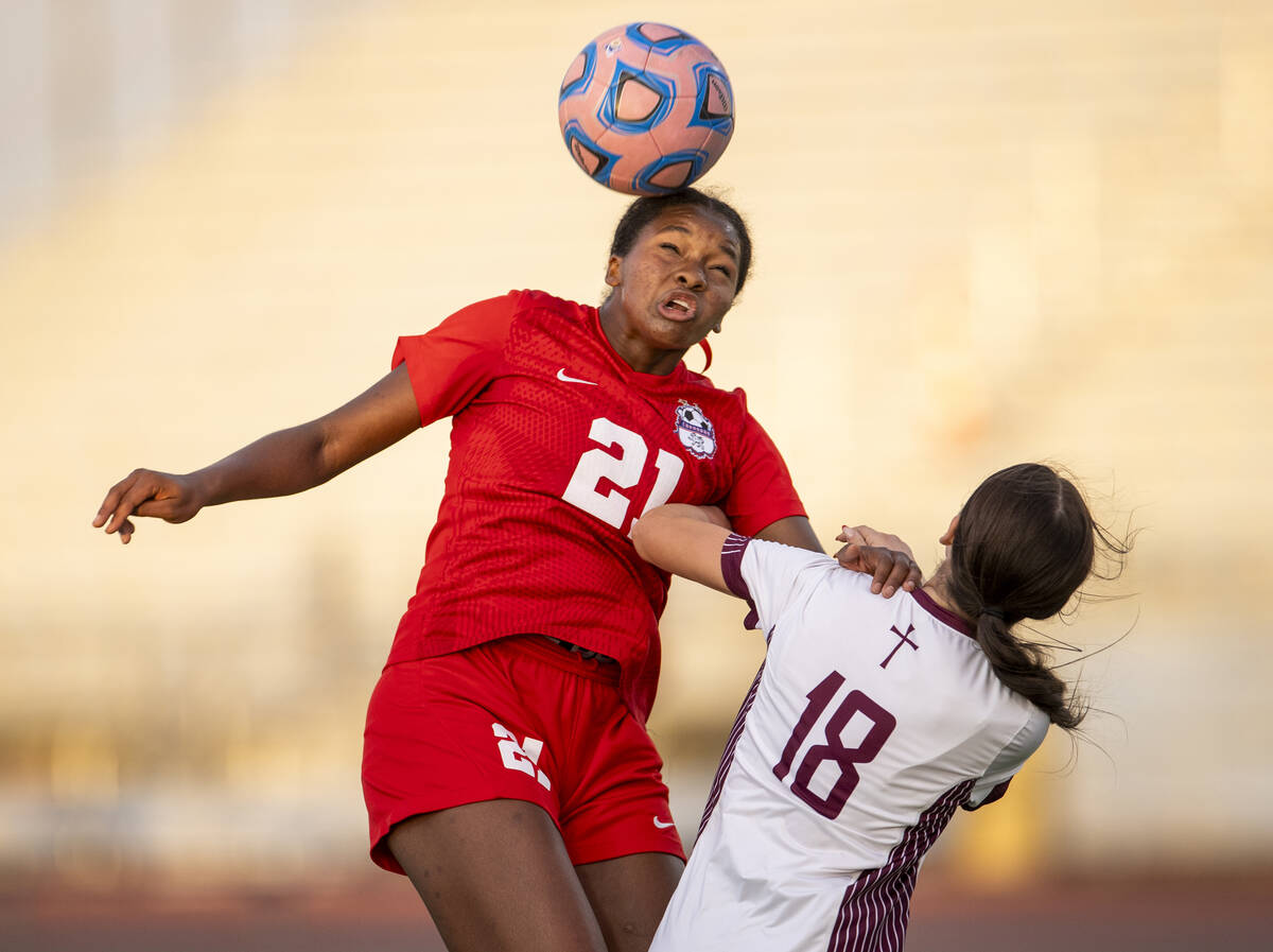 Coronado forward Jazmine Mccallum (21) headbutts the ball during the high school soccer game ag ...