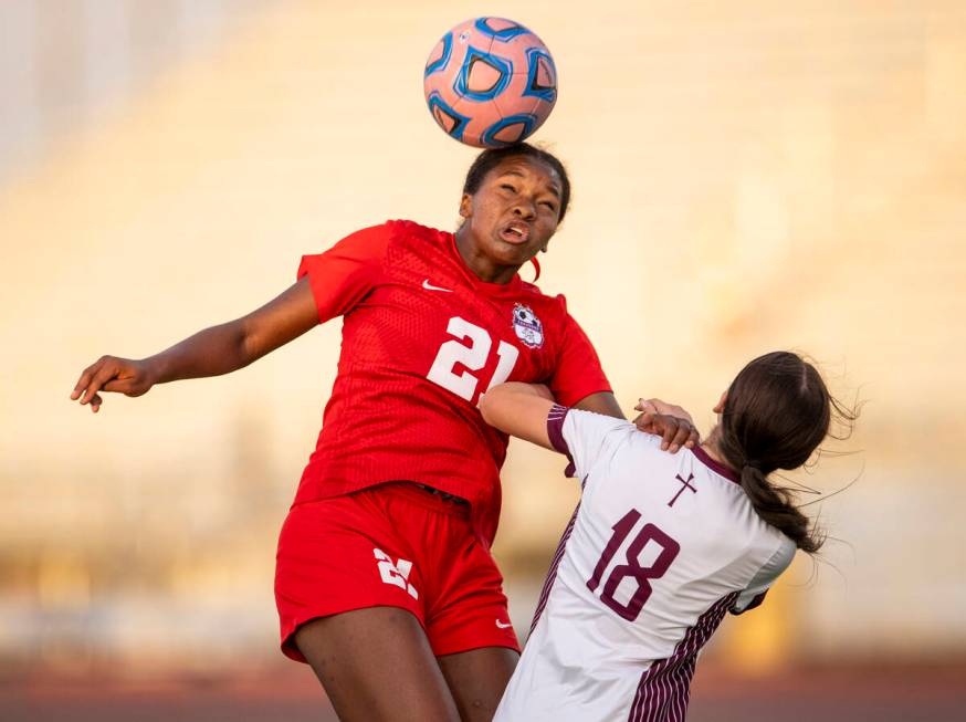 Coronado forward Jazmine Mccallum (21) headbutts the ball during the high school soccer game ag ...