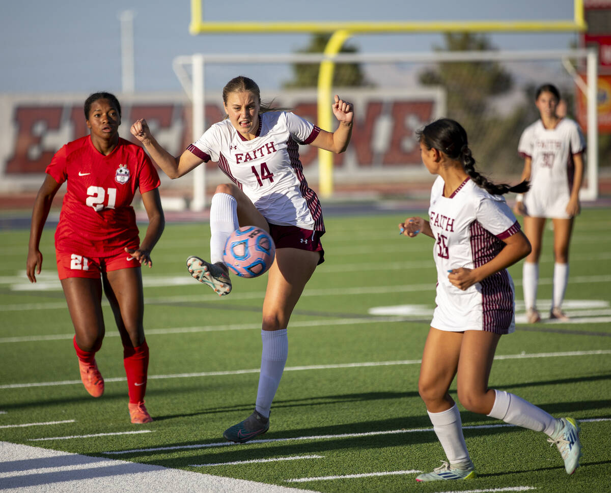 Faith Lutheran defender Kloe Abdalla (14) receives a pass during the high school soccer game ag ...