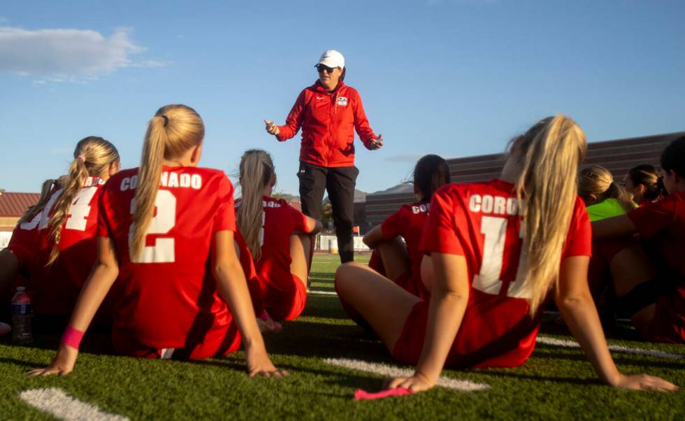 Coronado Head Coach Dana Neel talks to the team during halftime of the high school soccer game ...