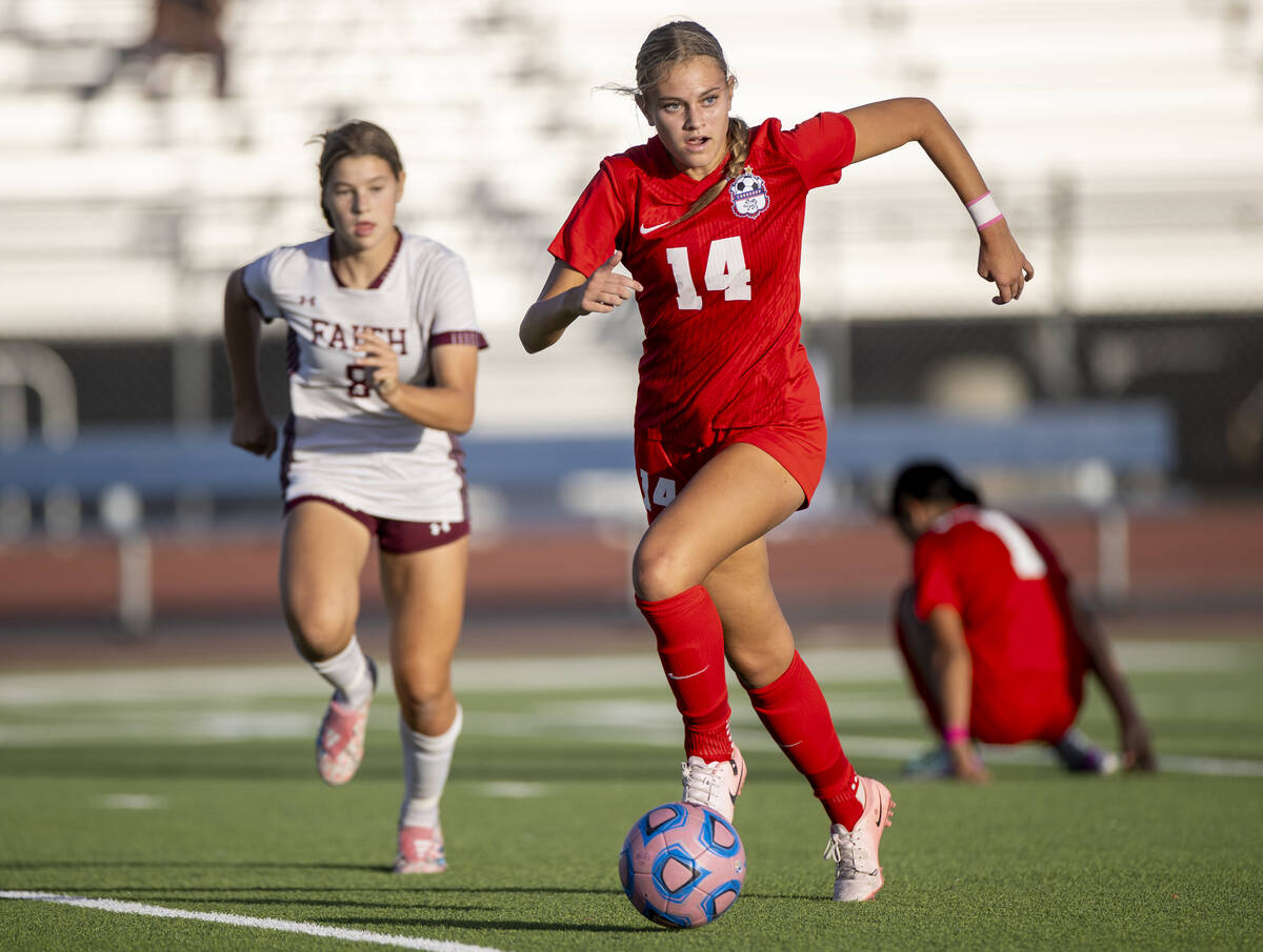 Coronado midfielder Allison Kleiner (14) moves the ball down the field during the high school s ...