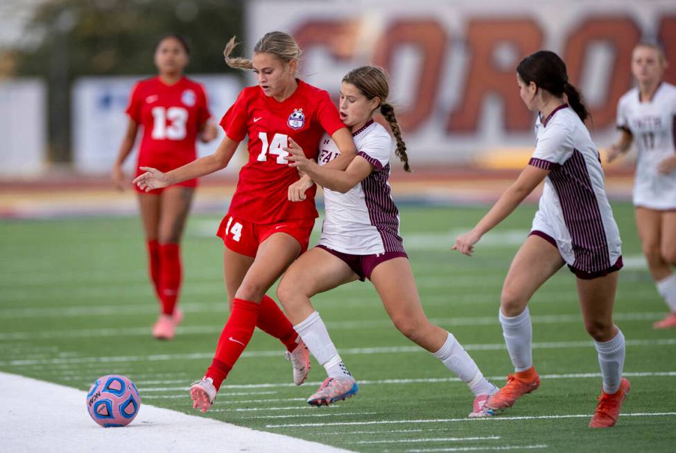 Coronado midfielder Allison Kleiner (14) and Faith Lutheran forward Olivia Stark (8) compete fo ...