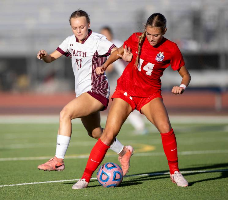 Faith Lutheran sophomore Julia Anfinson (17) and Coronado midfielder Allison Kleiner (14) compe ...