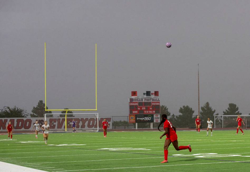 A pass is kicked to Coronado forward Jazmine Mccallum (21) as a haze begins to roll over the fi ...