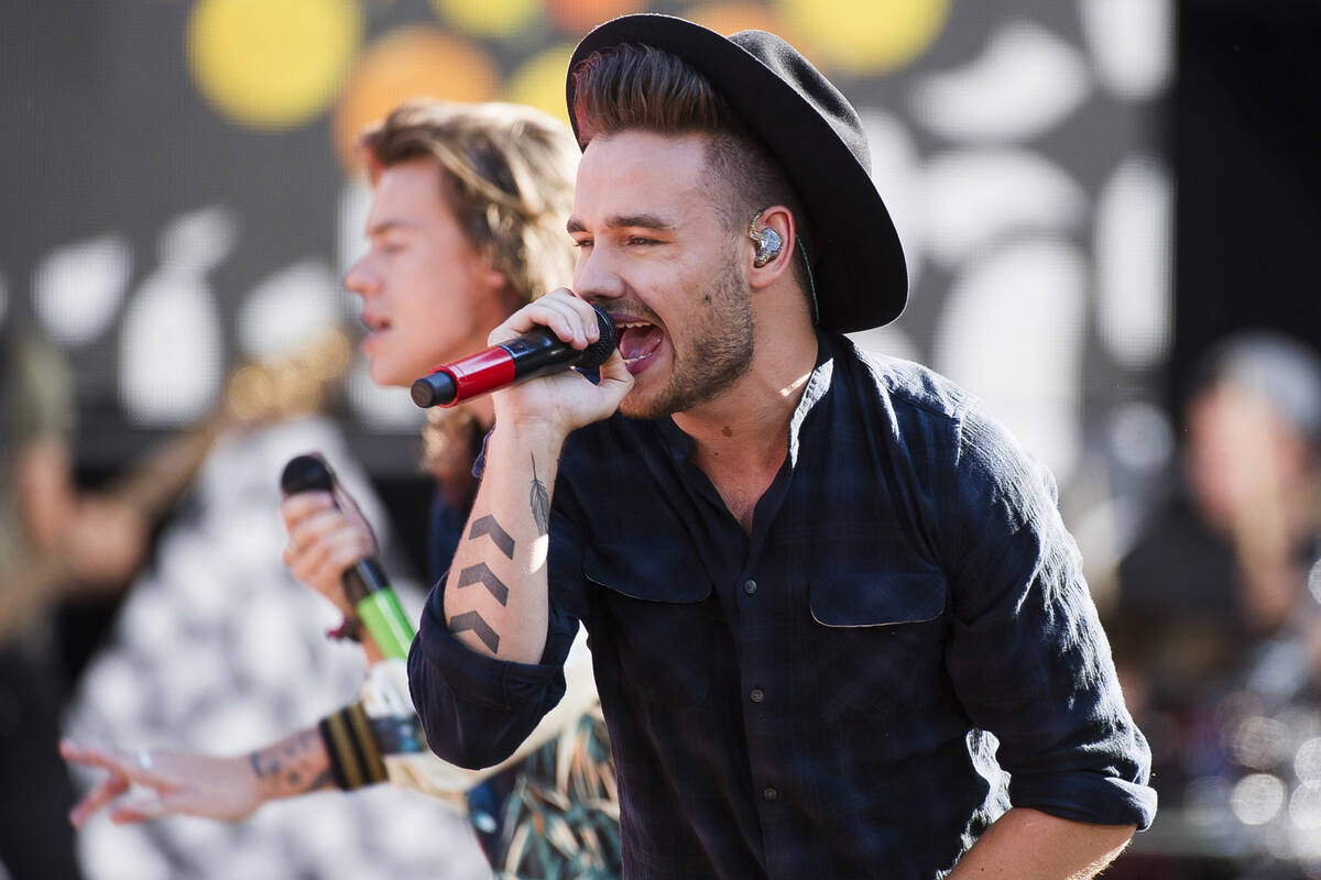 FILE - One Direction members, from right, Liam Payne and Harry Styles perform on ABC's "Go ...