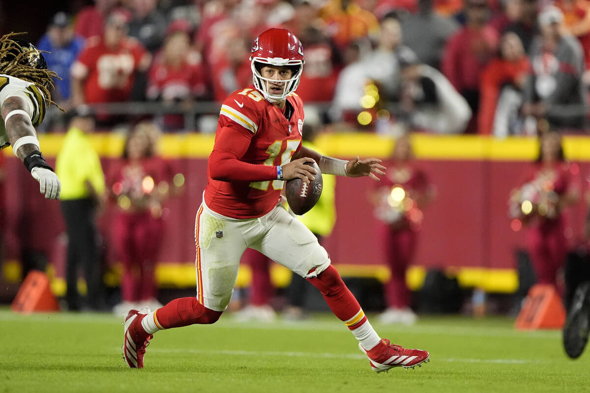 Kansas City Chiefs quarterback Patrick Mahomes looks to pass during the second half of an NFL f ...