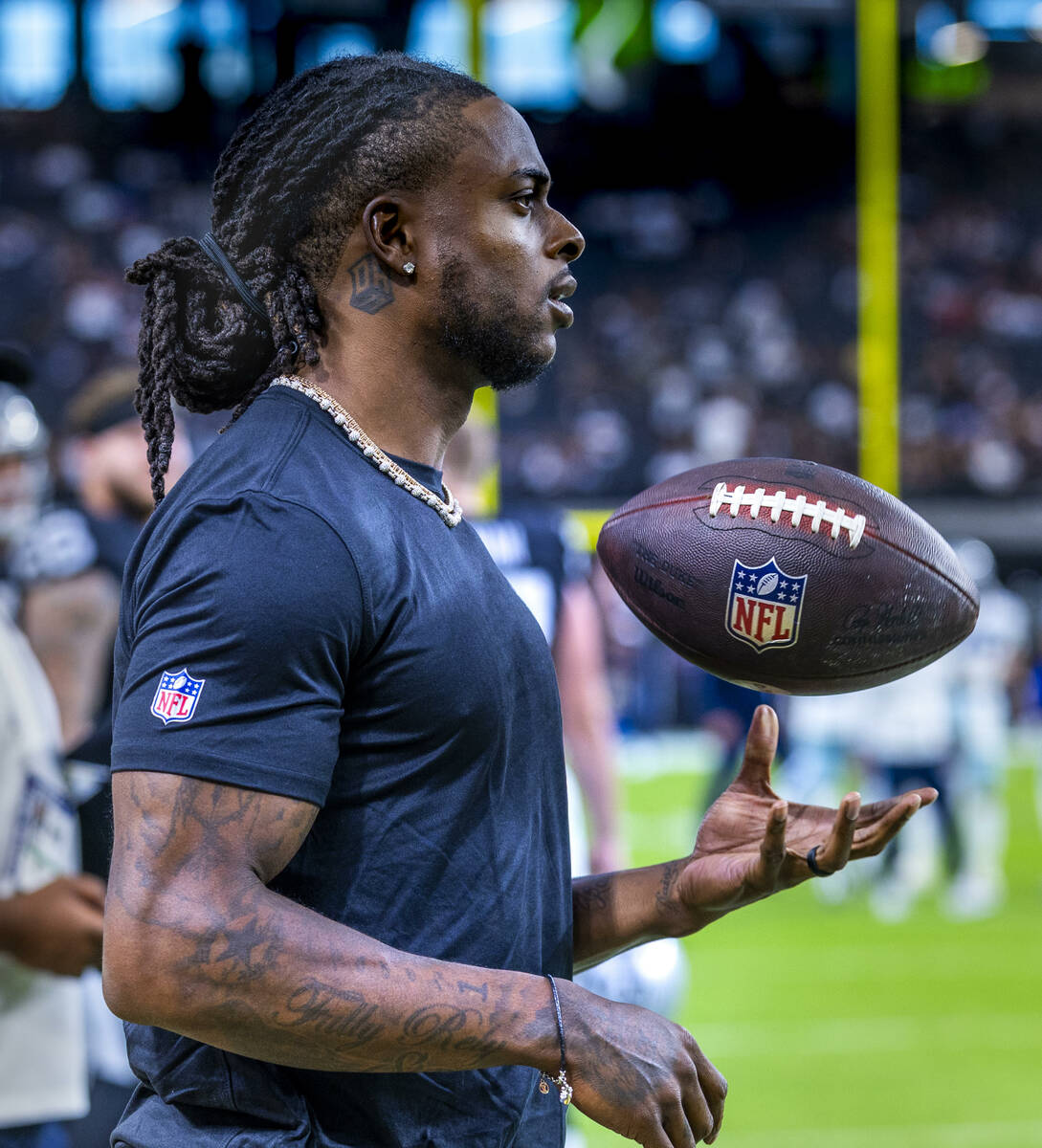 Raiders wide receiver Davante Adams (17) stands on the sidelines before the first half of their ...