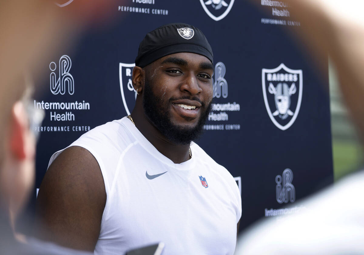 Raiders rookie defensive tackle DJ Glaze listens to reporters questions as he addresses the med ...