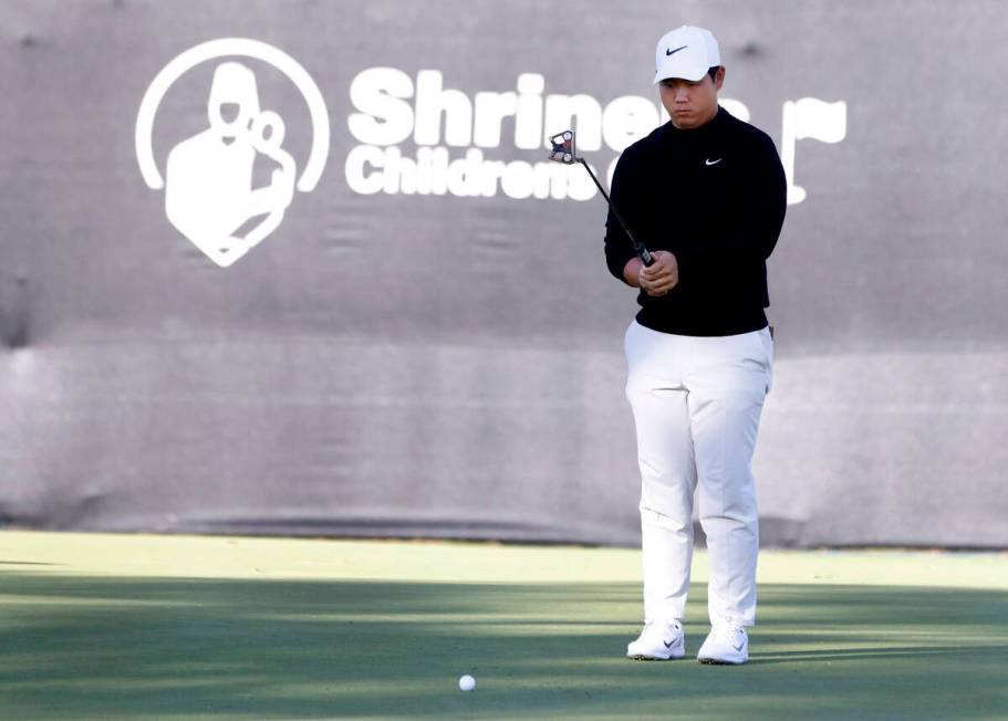 Tom Kim checks the line at hole #9 during the second round of the Shriners Children's Open at T ...