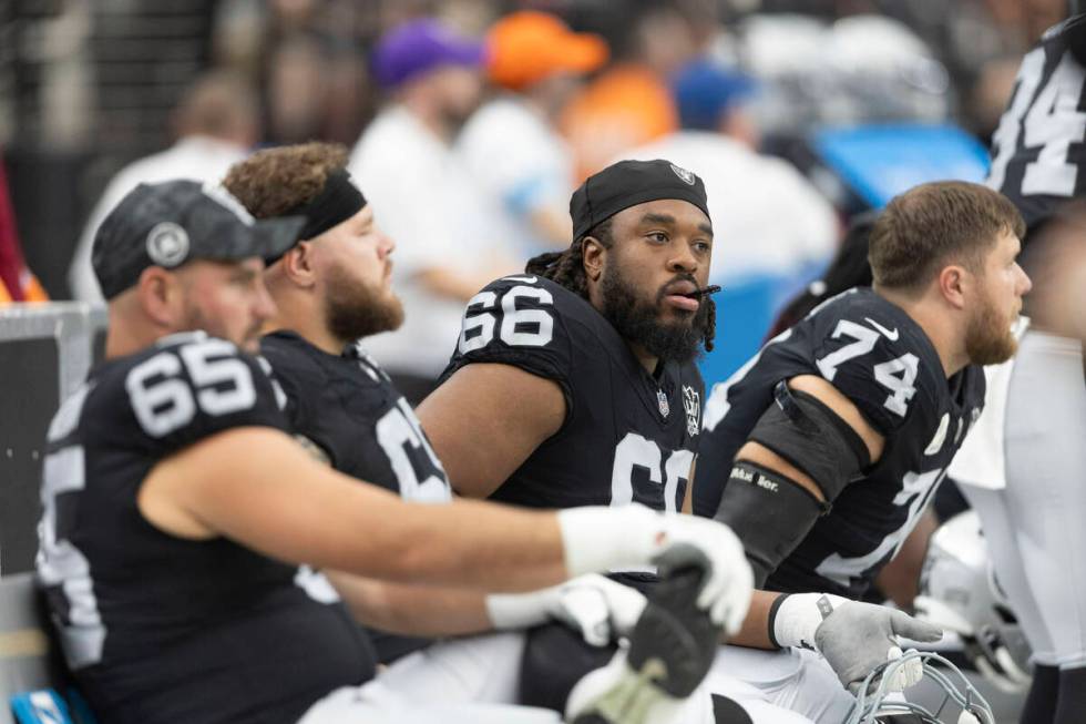 Raiders guard Dylan Parham (66) looks on from the sideline during the first half of an NFL game ...