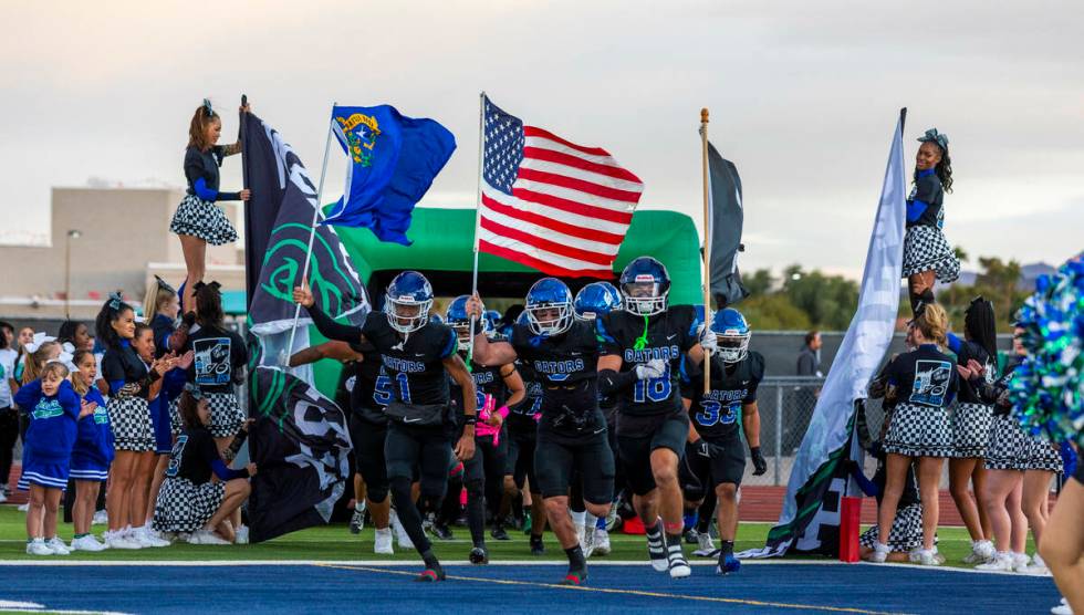 Green Valley players take the field to face Faith Lutheran for the first half of their NIAA foo ...