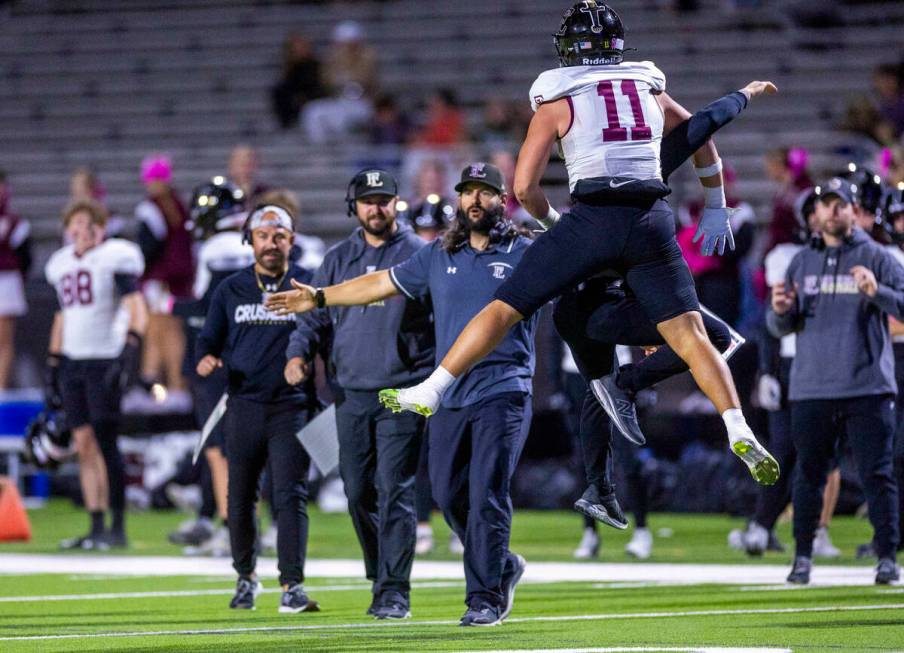 Faith Lutheran running back Patrick Duffy (11) celebrates a score against Green Valley during t ...