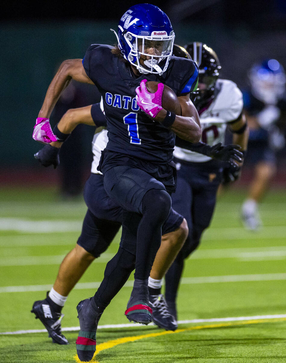 Green Valley wide receiver Trey Glasper (1) runs to the end zone against Faith Lutheran after a ...