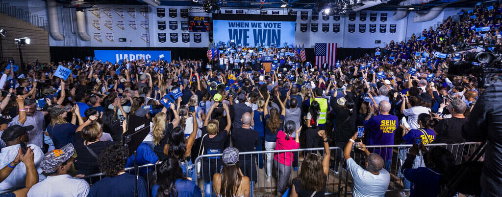 The crowd cheers as Former President Barack Obama speaks on behalf of the Harris-Walz campaign ...