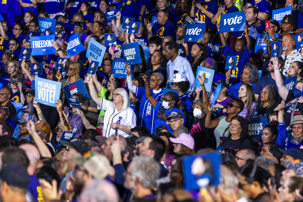 The crowd listens as Former President Barack Obama speaks on behalf of the Harris-Walz campaign ...