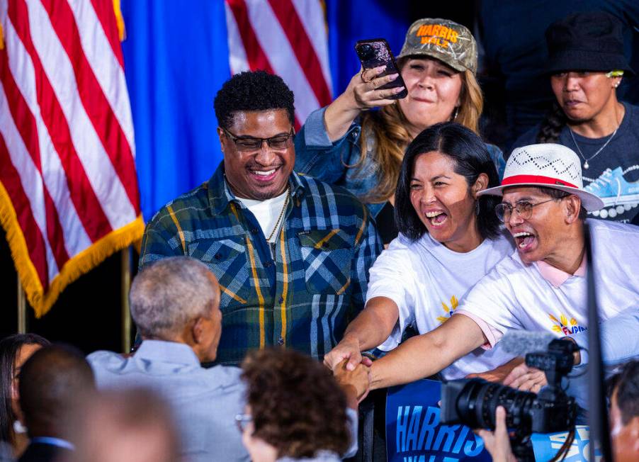 Former President Barack Obama greets members of the crowd after speaking on behalf of the Harri ...