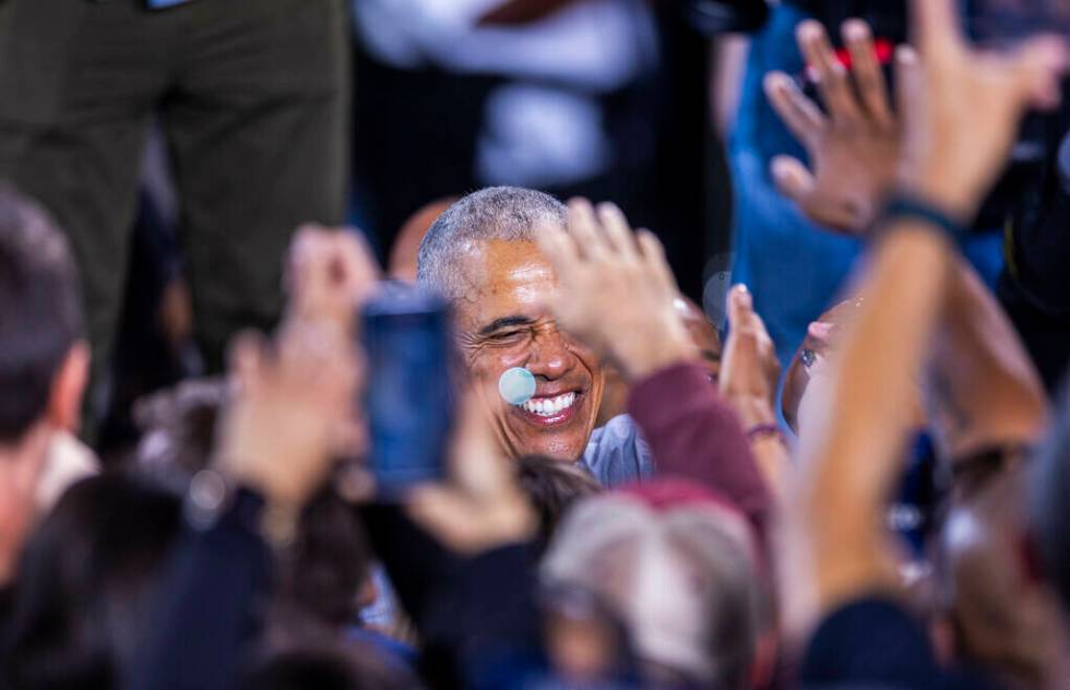 Former President Barack Obama greets members of the crowd after speaking on behalf of the Harri ...