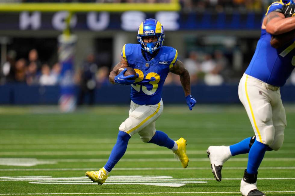 Los Angeles Rams running back Kyren Williams runs during the first half of an NFL football game ...