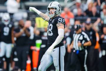 Raiders defensive end Maxx Crosby (98) points during the first half of an NFL football game bet ...