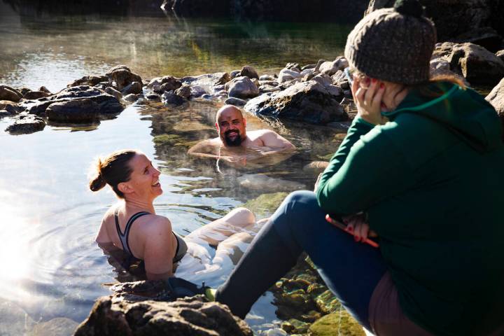 Kristen Taylor, from left, talks with Earl Britos, center, and Marina Pitina, right, all of Las ...