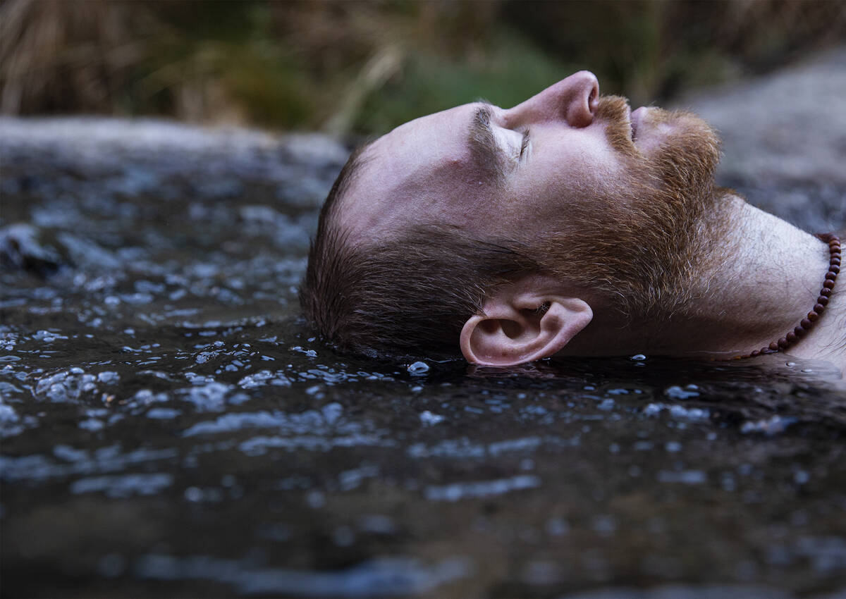 Andy Udelsman, of Las Vegas, lays in the warm waters from the Gold Strike Hot Springs along the ...