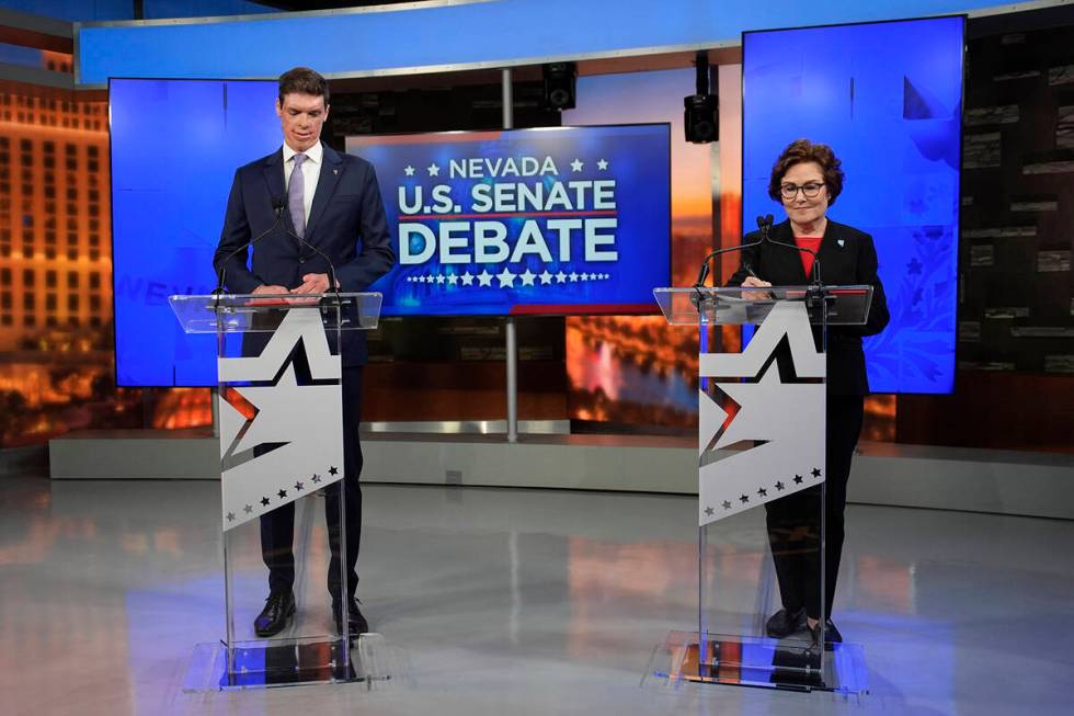 Republican senatorial candidate Sam Brown, left, and Sen. Jacky Rosen, D-Nev., prepare before a ...