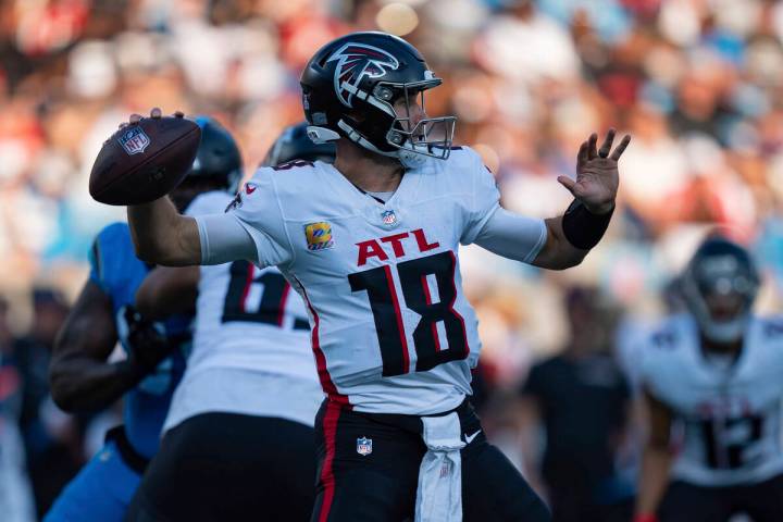 Atlanta Falcons quarterback Kirk Cousins (18) plays against the Carolina Panthers during an NFL ...