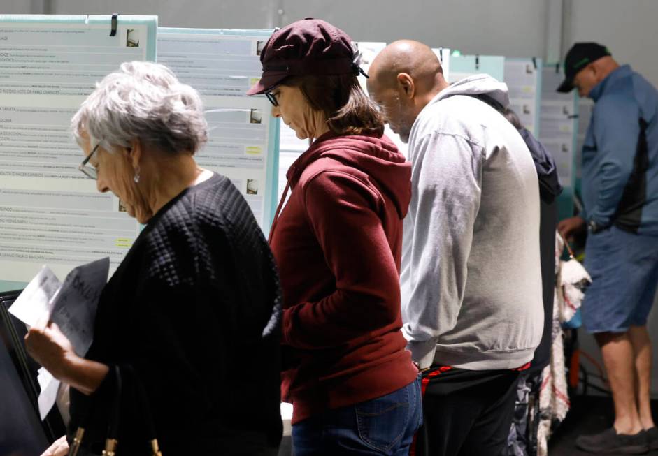 People cast their vote during early voting at Thunderbird Family Sports Complex, on Saturday, O ...