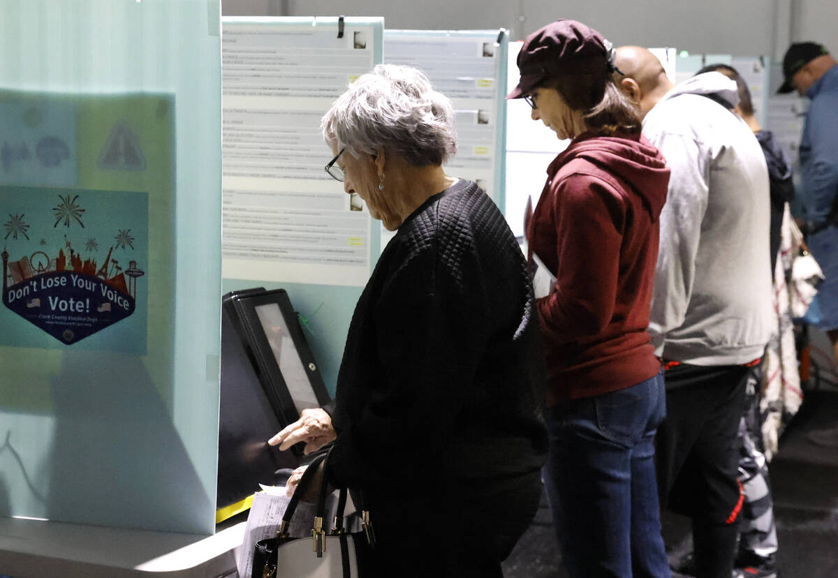 People cast their vote during early voting at Thunderbird Family Sports Complex, on Saturday, O ...