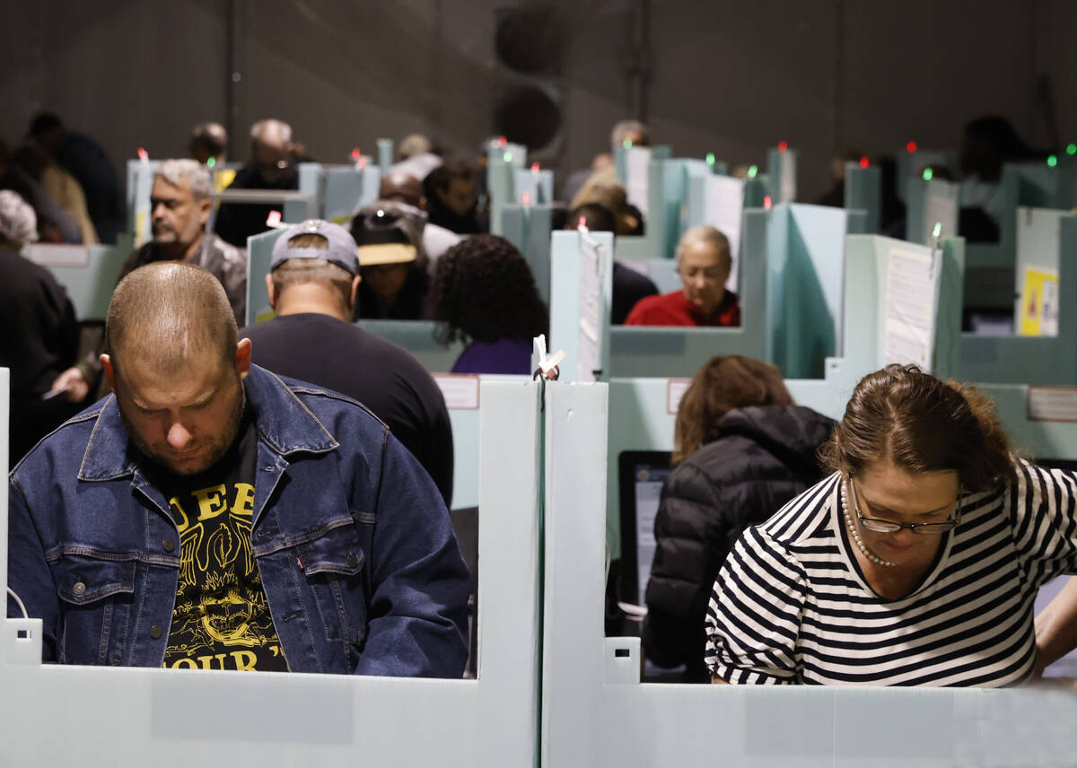 People cast their vote during early voting at Thunderbird Family Sports Complex, on Saturday, O ...