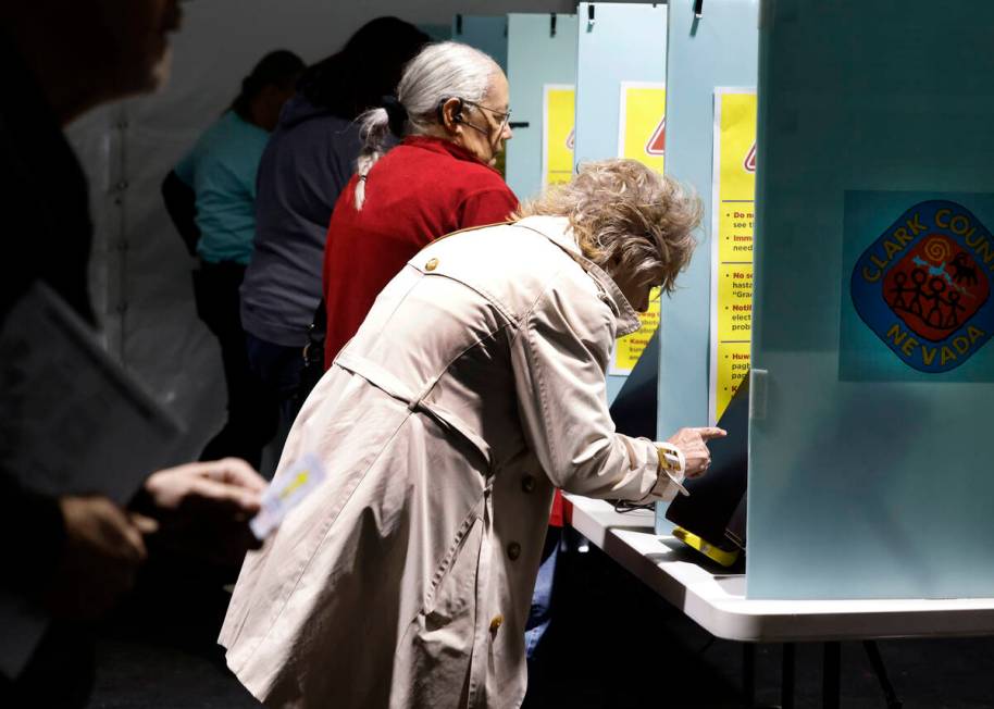 People cast their vote during early voting at Thunderbird Family Sports Complex, on Saturday, O ...