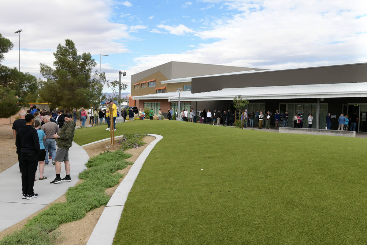 Voters line up outside the Silverado Ranch Community Center to take part in early voting Saturd ...