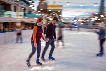 Lauren, left, and Kyle Kaehler of Sacramento skate on the ice rink at The Cosmopolitan of Las V ...