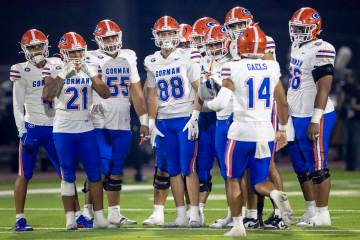 The Bishop Gorman offense waits for Bishop Gorman quarterback Maika Eugenio (14) to give the pl ...