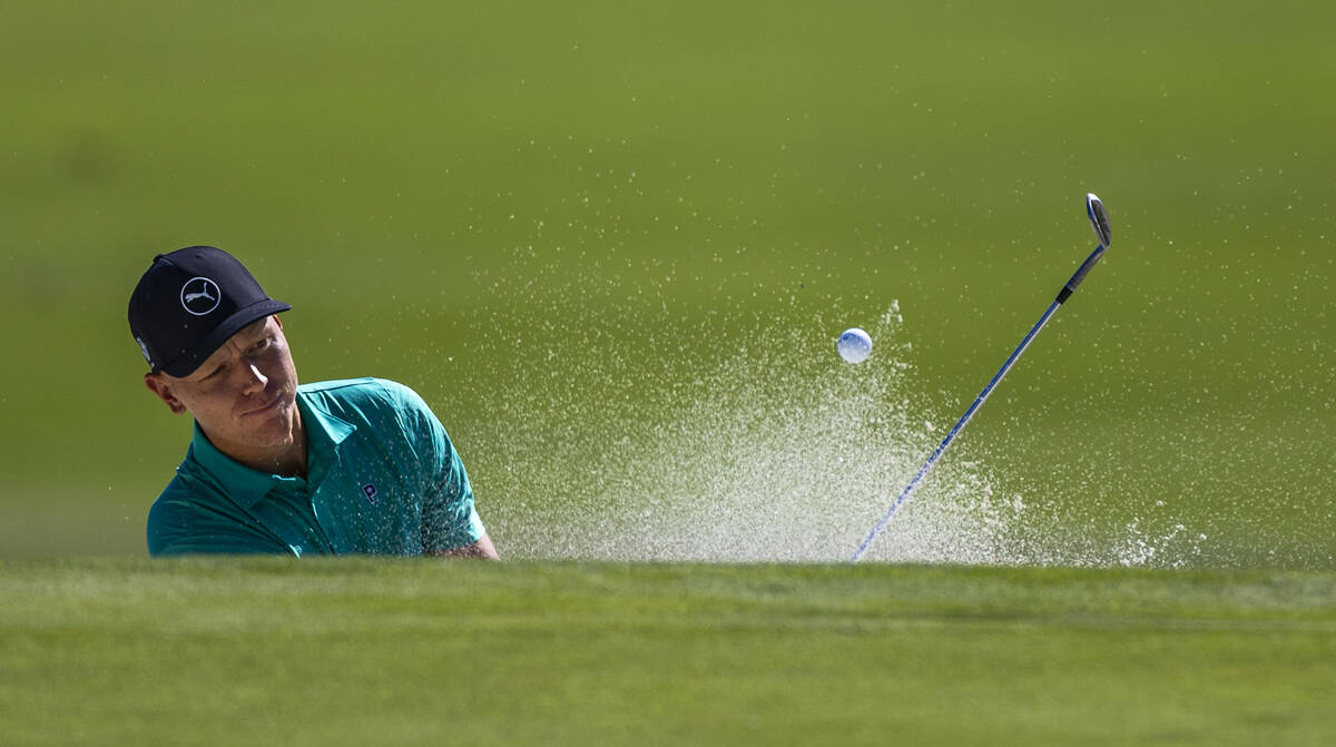 Matti Schmid chips out of a bunker on hole #9 during the opening round of the Shriners Children ...