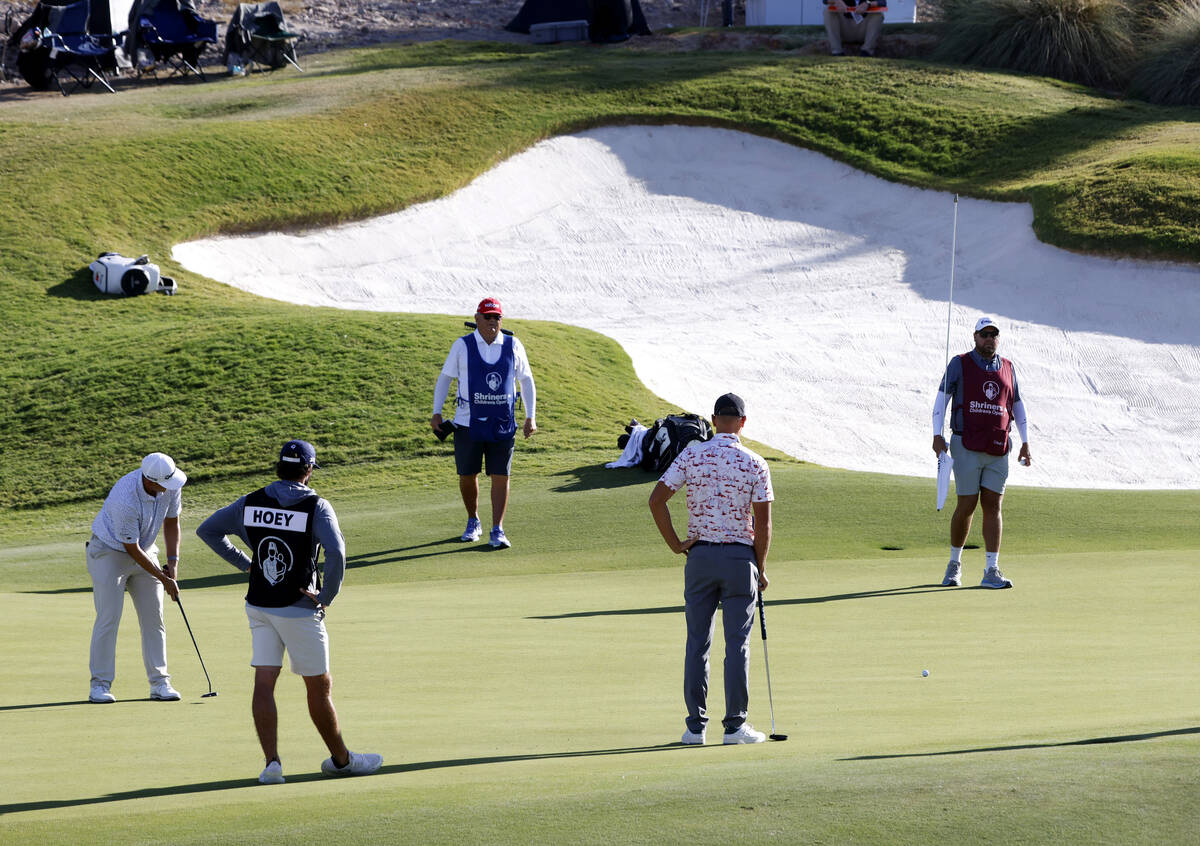 Rico Hoey, left, eyes a putt at green No. 6 during the third round of the Shriners Children's O ...