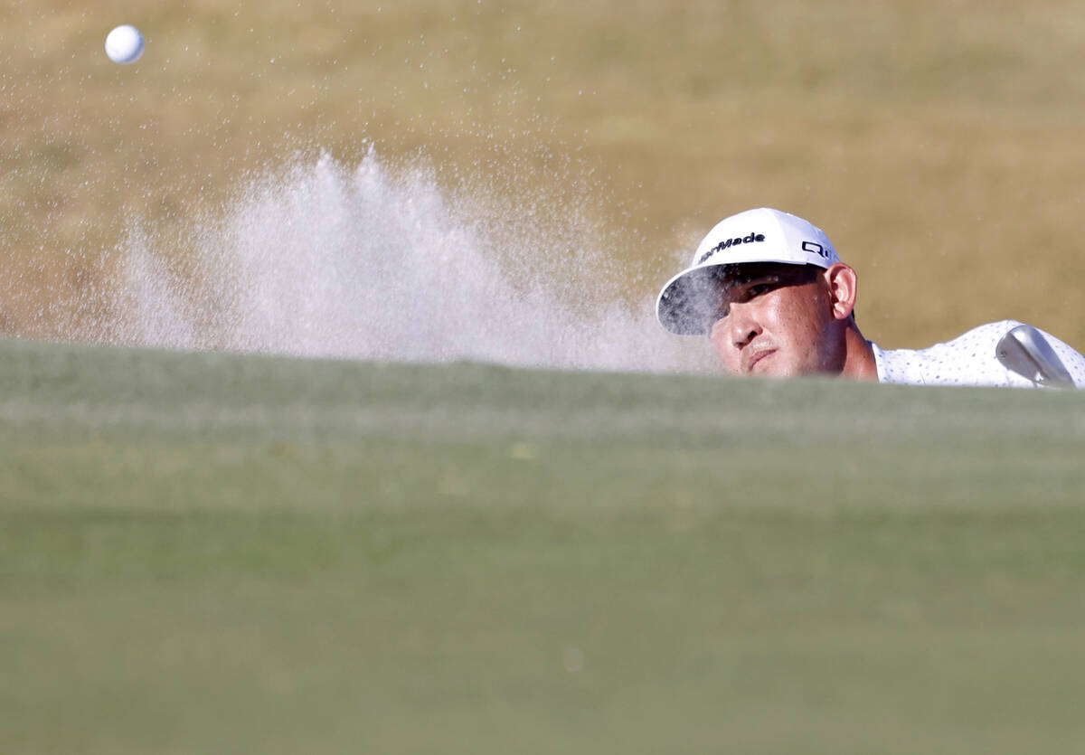 Rico Hoey blasts out of a bunker at green No. 4 during the third round of the Shriners Children ...