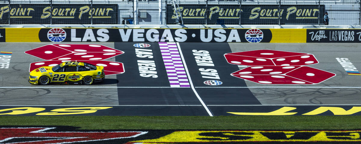 Joey Logano (22) passes the start/finish line during the NASCAR Cup Series practice session for ...