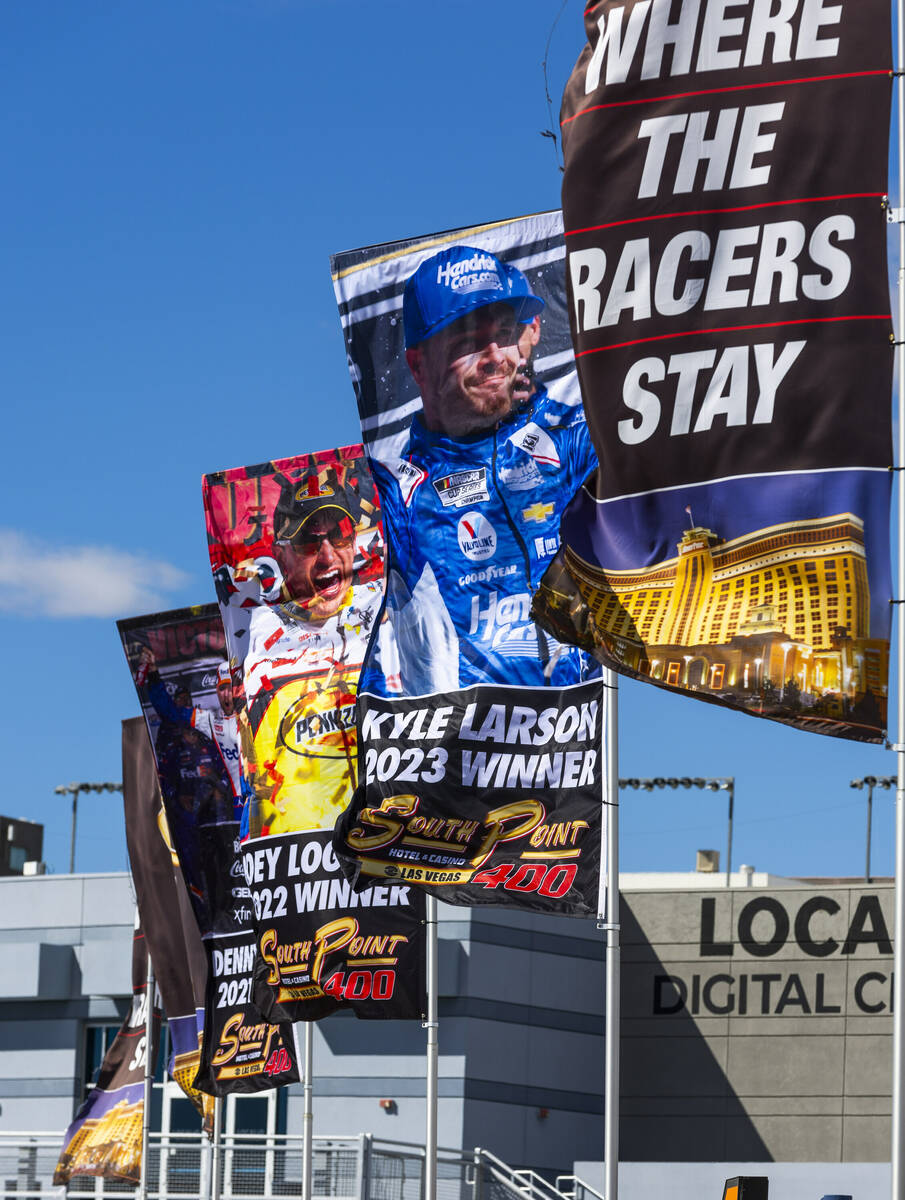 Banners wave in a strong wins about the Neon Garage before NASCAR Cup Series practice and quali ...