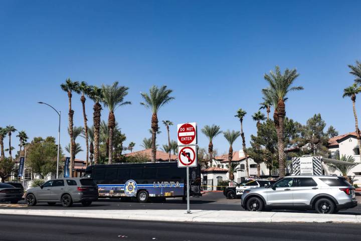 Police investigate the scene of an officer involved shooting near East Tropicana Avenue and Sou ...