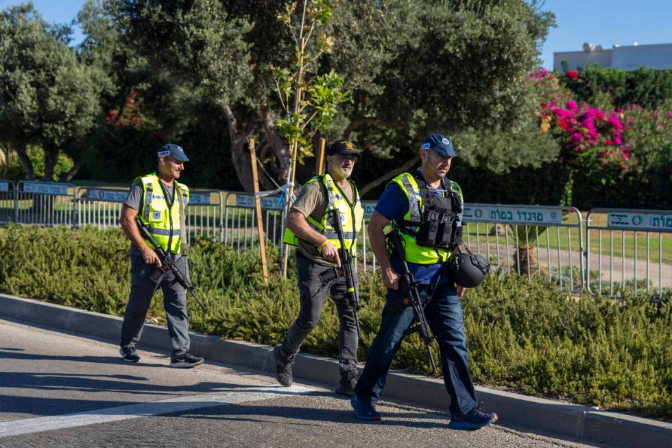 Israeli security forces secure a road near where Israel's government says a drone launched towa ...