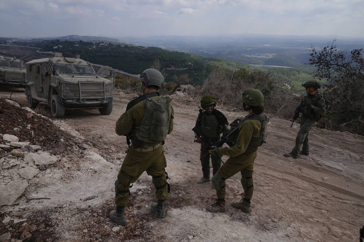 Israeli soldiers are seen during a ground operation in southern Lebanon, near the border with I ...